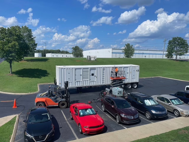 CAT generator enclosure in parking lot